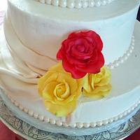 roses and drapes wedding cake