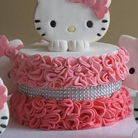 A ruffle Hello kitty cake with sugar cookies 
