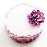 Purple ruffle cake with poppy flower