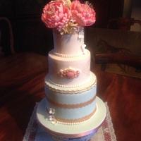 Peony rose and gold accents wedding cake