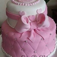 Pink and white baby shower cake
