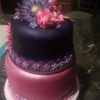 pink and purple cake with gerber daisy