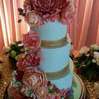 3 tiered cake with all handmade sugar flowers