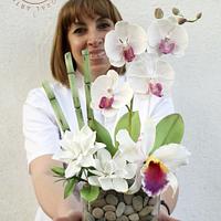 Bouquet of flowers in sugar. Phalaenopsis orchid, Cattleya orchid, Gardenias and Bamboo