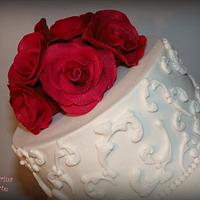 White Wedding Cake with Red Roses