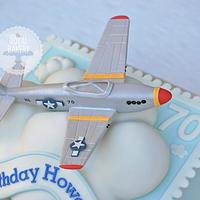Airplane on a cloud on a stamp on a cake