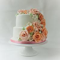 Pink and Peach wedding cake and 45 matching floral cupcakes.