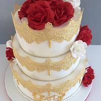 Red and gold wedding cake