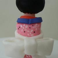 Kokeshi doll gumpaste topper