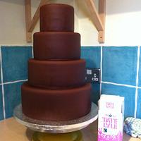 Chocolate and white wedding cake with birds topper