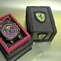 chocolate watch in a chocolate box with hot chili candies 