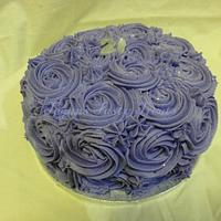 Purple buttercream cake and cupcakes.