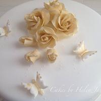Gold Roses with white and gold royal iced butterflies