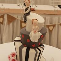 Mad Hatter wedding cake with fishing groom