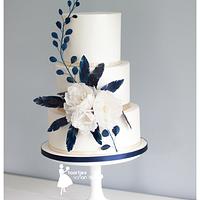 Blue waterpaper feathers and white peonies