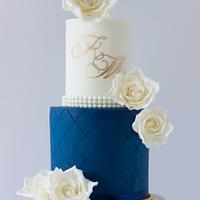 Classy and simple wedding cake in royal blue and white