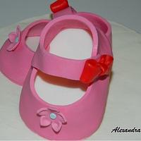 Pink baby shoes cake
