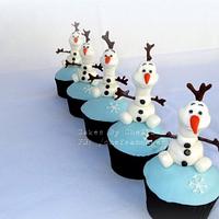 Elsa doll cake and Olaf cupcakes