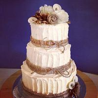 Rustic buttercream cake with paper flowers