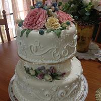 Wedding cake with fondant flowers and scrolls