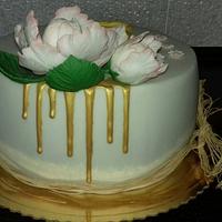 gold drip cake with peony
