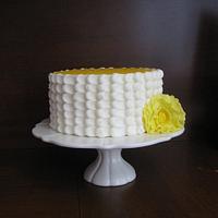BUTTERCREAM CAKE WITH A FONDANT YELLOW FLOWER