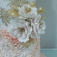 Wedding cake in peach , gold and peony