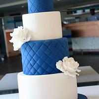 Navy and White Wedding Cake with Sugar Swans and White Roses 