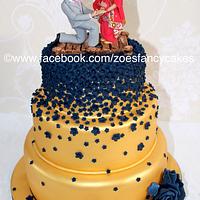 The finished gold and navy Indian wedding cake