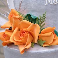 silver and orange wedding cake