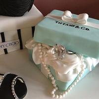Jimmy Choo shoe, handbag and Tiffany box.