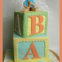 Baby ABC Blocks Cake with a Little Boy Topper ~