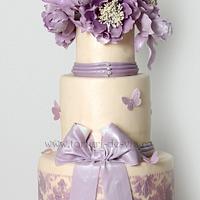 Baroque wedding cake with purple peonies