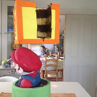 Super Mario block busting cake.