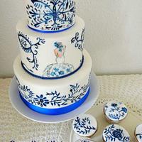 Blue-white wedding cake with cupcakes