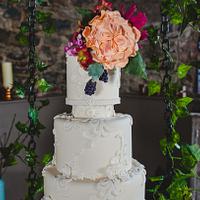 Swinging cake with sugar flowers and applique lace