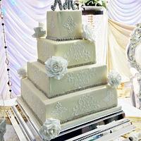 Four tier white on ivory wedding cake