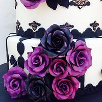 Black and purple roses wedding cake
