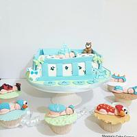 Baby shower cake with cupcakes 