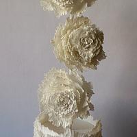 Frilled wedding cake with over-sized flowers