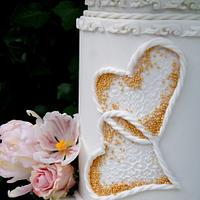 White wedding cake and flowers