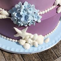 Shells and Blue hydrangeas Purple Ombre wedding cake