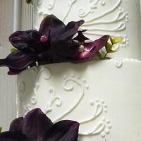 Buttercream cake with hand piped scrollwork