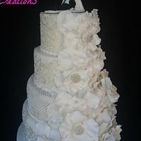 Rose petal and lace wedding cake