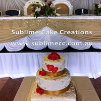 GOLD AND RED WEDDING CAKE