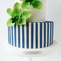 green orchids and Navy stripes wedding cake