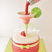 Pouring "Straw-Ber-Rita" beer can cake