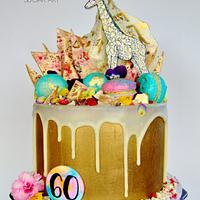 Gold giraffe drip cake