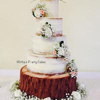 Semi naked wedding cake with edible log stand 