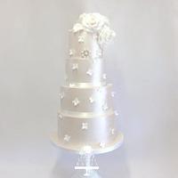 Four tier shimmering wedding cake